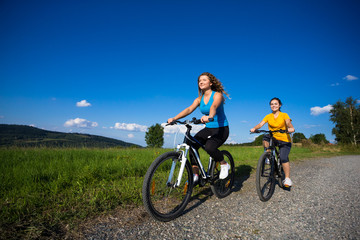 Fototapeta na wymiar Healthy lifestyle - young women biking