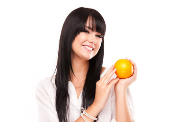 beautiful brunette woman with orange on white background