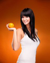 beautiful brunette woman with orange on orange background