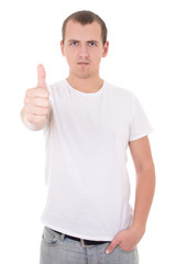 Naklejka premium young attractive man in white t-shirt thumbs up isolated on whi