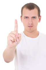 portrait of young man pointing upwards over white background