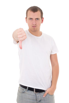 young man showing thumbs down isolated on white
