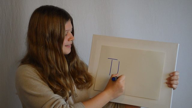 Girl with board writing team
