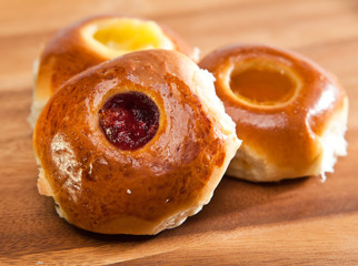 Obraz na płótnie Canvas Rolls from yeast dough with jam