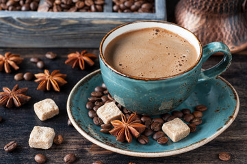 Cup of coffee with sugar and spices
