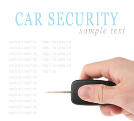 Hand holding car keys isolated on white background