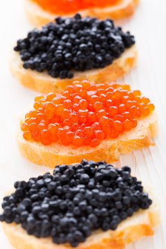 Sandwiches with black and red caviar