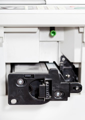insert of toner cartridge in office copier