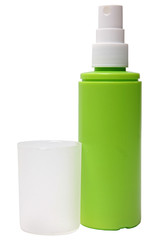 Green plastic bottle of spray isolated on a white background.