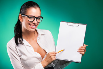 Young business woman with form and pencil