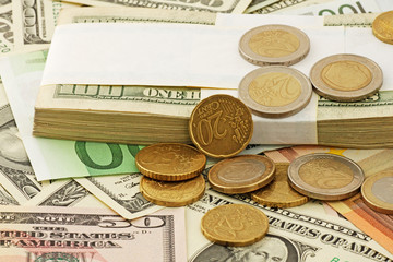 euro cents on euro and dollars banknotes