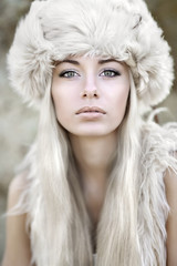 portrait of a beautiful young girl in fur