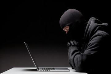 Computer hacker in a balaclava