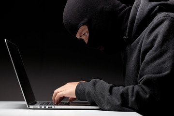 Computer hacker in a balaclava © Sergey Mironov