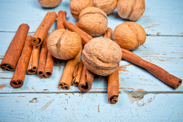 walnuts and cinnamon on wooden boards