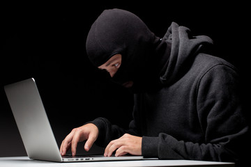 Computer hacker in a balaclava