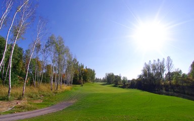 Fototapeta na wymiar Golf course landscape view, green field