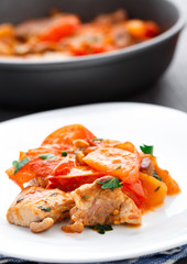Fried pork with pan-roasted tomatoes