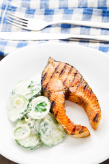 Grilled salmon with cucumber salad