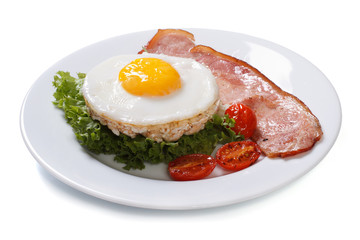 fried eggs with bacon, lettuce and tomato isolated on white