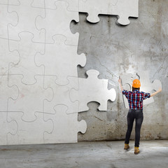 Woman engineer with puzzle