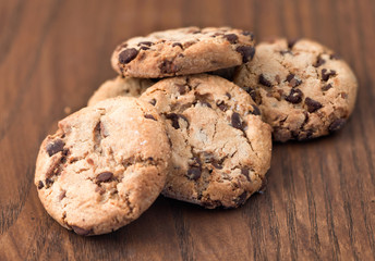 Chocolate chip cookies on wooden background