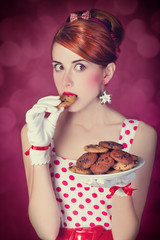 Beautiful redhead women with coockie