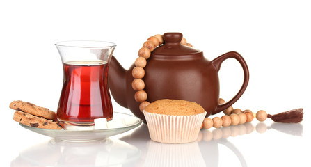 glass of Turkish tea and kettle isolated on white
