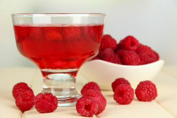 Jelly with fresh berries on wooden table
