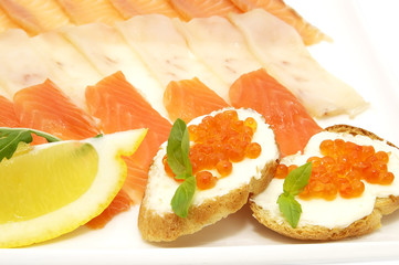 slicing fish and sandwiches with caviar