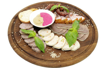 plate of sausage and bacon on white background