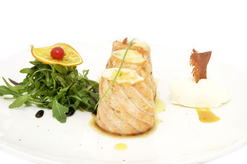 fried fish rolls with herbs on a white plate