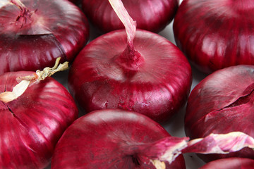 Fresh red onions close up