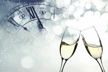 Glasses with champagne against fireworks © erika8213