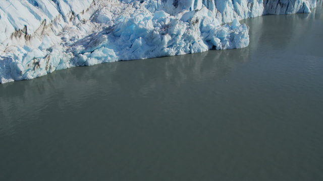 Aerial view ice glacier constantly moving under its own gravity, Alaska