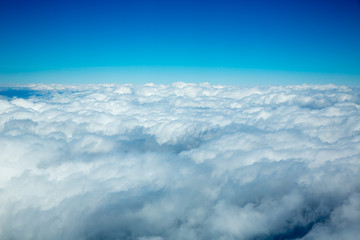 Fototapeta na wymiar Aerial fluffy clouds view from high like a sea