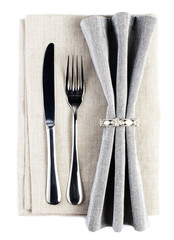 Elegant dinner table setting with fork and knife  on a grey tabl