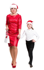 Mother and daughter in santa hats