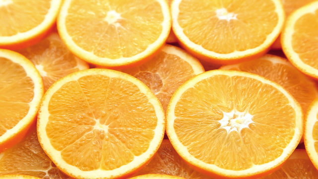 Orange slices. Fresh and juicy sliced oranges motion background