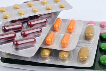 assortment of pills and capsules in blister packaging