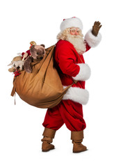 Real Santa Claus carrying big bag - obrazy, fototapety, plakaty