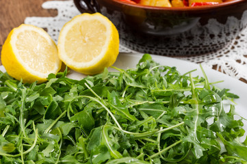 red peppers, potatoes and green salad called rucola