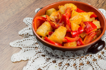 Fresh vegetable stew made of  potato, red bell pepper, tomato in