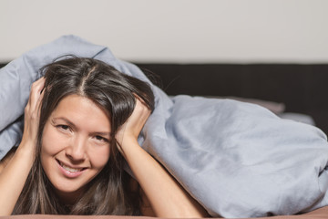 Smiling attractive woman enjoying a lazy day