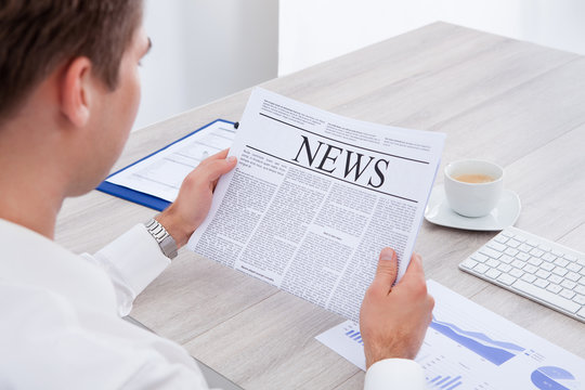 Businessman Reading Newspaper