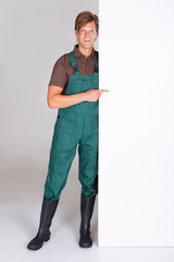 Male Gardener Presenting Blank Placard