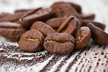 Coffee beans on wood background
