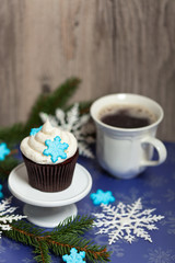 Christmas theme. Cupcake with snowflake