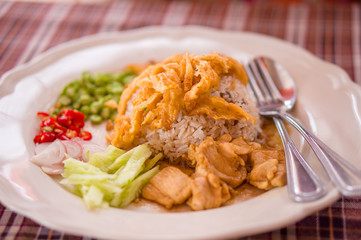Spicy rice with chicken, eggs, pepper salad