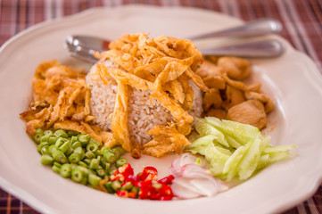 Spicy rice with chicken, eggs, pepper salad